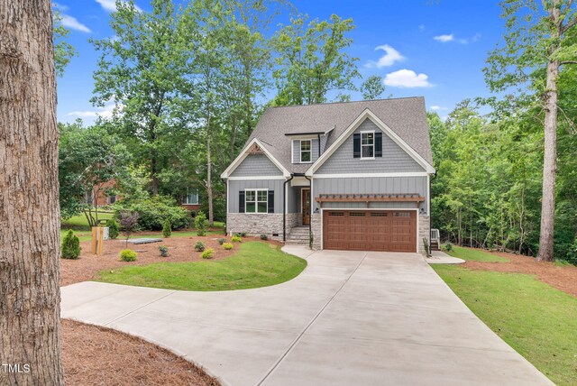 5504 Earle Rd, Raleigh, NC 27606 - craftsman inspired home with stone siding, driveway, a front lawn, and an attached garage
