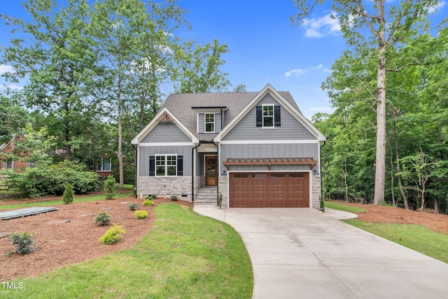 5504 Earle Rd, Raleigh, NC 27606 - craftsman-style home featuring stone siding, a garage, driveway, board and batten siding, and a front lawn
