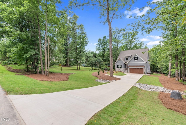 5504 Earle Rd, Raleigh, NC 27606 - view of front of property featuring driveway, an attached garage, a front lawn, and view of scattered trees