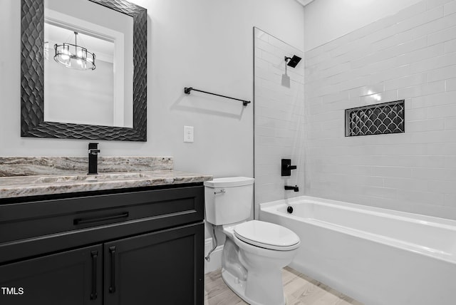 5504 Earle Rd, Raleigh, NC 27606 - bathroom featuring wood finished floors, vanity, and tub / shower combination