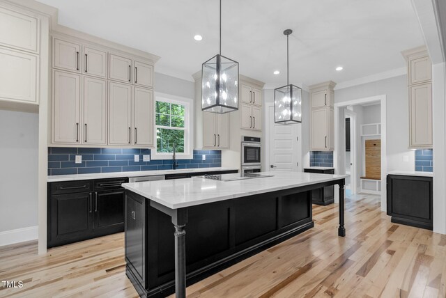 5504 Earle Rd, Raleigh, NC 27606 - kitchen featuring dark cabinets, backsplash, light wood-type flooring, hanging light fixtures, and recessed lighting