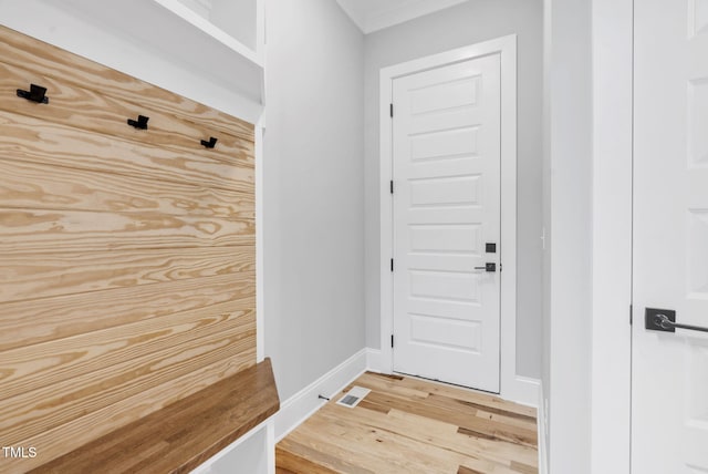 5504 Earle Rd, Raleigh, NC 27606 - mudroom with light wood-style flooring and ornamental molding