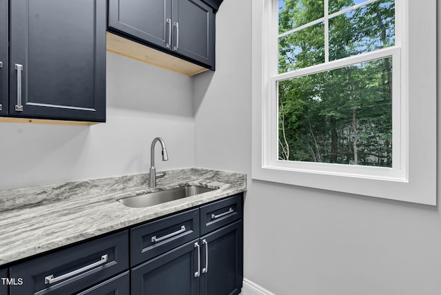 5504 Earle Rd, Raleigh, NC 27606 - bar featuring a sink and baseboards