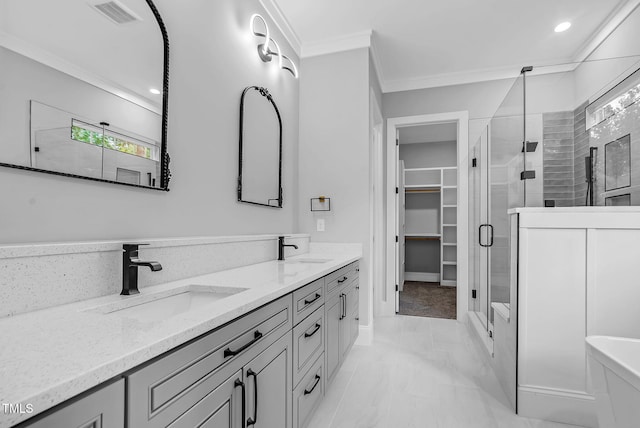 5504 Earle Rd, Raleigh, NC 27606 - bathroom with a stall shower, double vanity, ornamental molding, marble look tiles, and a spacious closet