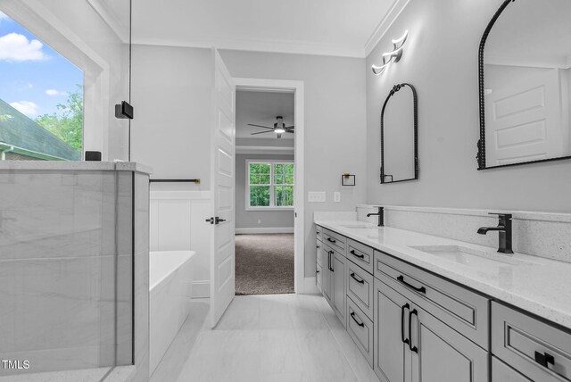 5504 Earle Rd, Raleigh, NC 27606 - full bathroom with double vanity, a soaking tub, a ceiling fan, marble finish flooring, and ornamental molding