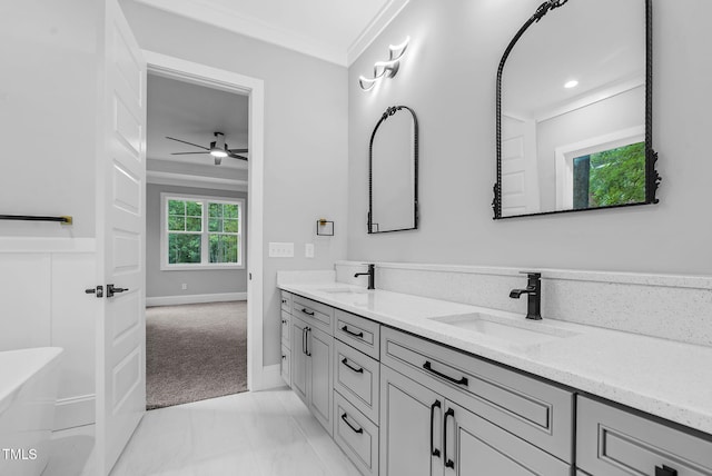 5504 Earle Rd, Raleigh, NC 27606 - full bath featuring double vanity, a ceiling fan, crown molding, marble finish floors, and recessed lighting