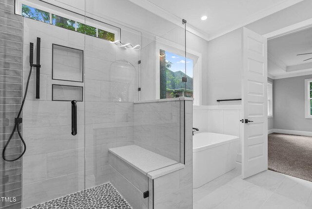 5504 Earle Rd, Raleigh, NC 27606 - bathroom with a stall shower, a freestanding tub, ornamental molding, and recessed lighting