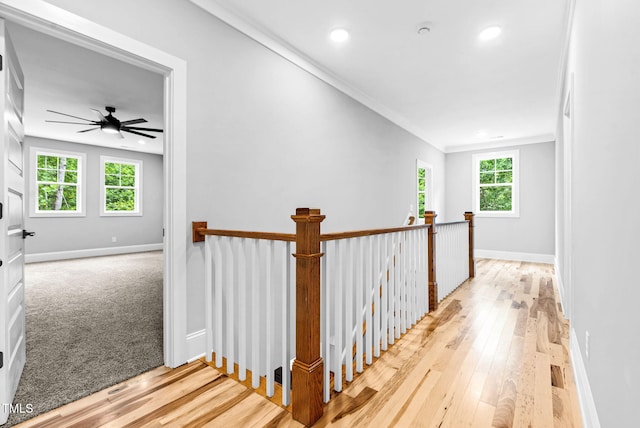 5504 Earle Rd, Raleigh, NC 27606 - hallway with an upstairs landing, hardwood / wood-style flooring, recessed lighting, and crown molding