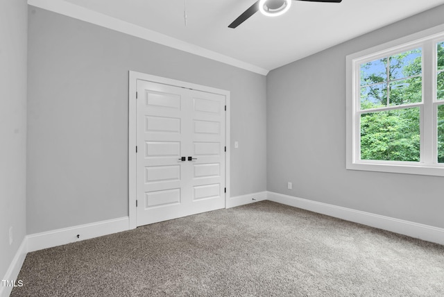 5504 Earle Rd, Raleigh, NC 27606 - unfurnished bedroom with carpet floors and ceiling fan