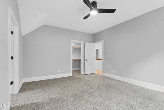 5504 Earle Rd, Raleigh, NC 27606 - unfurnished bedroom featuring carpet, a spacious closet, a ceiling fan, and a closet