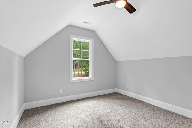 5504 Earle Rd, Raleigh, NC 27606 - additional living space with ceiling fan, carpet floors, and vaulted ceiling