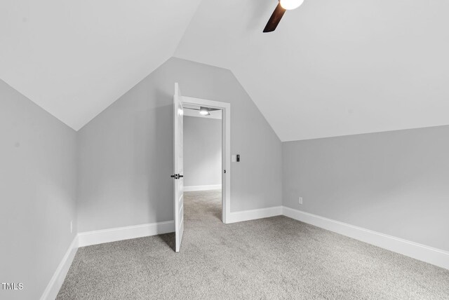 5504 Earle Rd, Raleigh, NC 27606 - additional living space featuring carpet floors, vaulted ceiling, and a ceiling fan