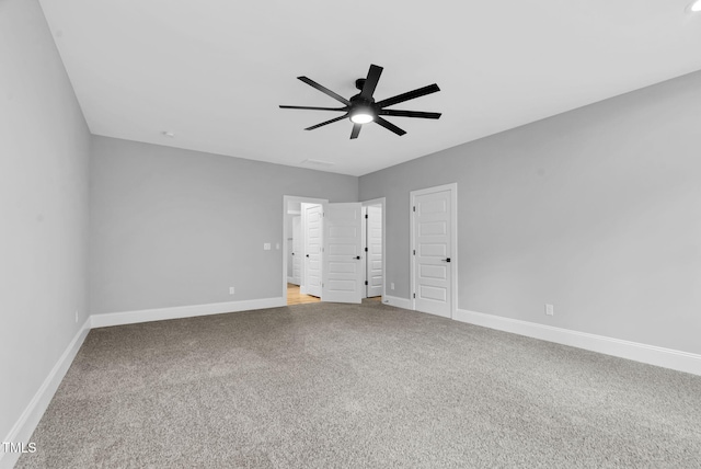 5504 Earle Rd, Raleigh, NC 27606 - unfurnished bedroom featuring carpet and ceiling fan