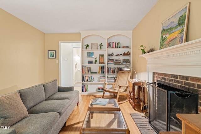 20 Timberlyne Rd, Chapel Hill, NC 27514 - living room with wood finished floors, a brick fireplace, and built in features