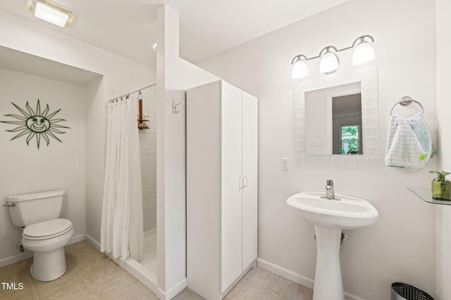 20 Timberlyne Rd, Chapel Hill, NC 27514 - bathroom with toilet, tile patterned flooring, a shower stall, and baseboards