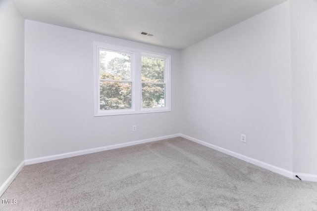 404 Shannonford Ct, Wake Forest, NC 27587 - carpeted empty room with baseboards and a textured ceiling