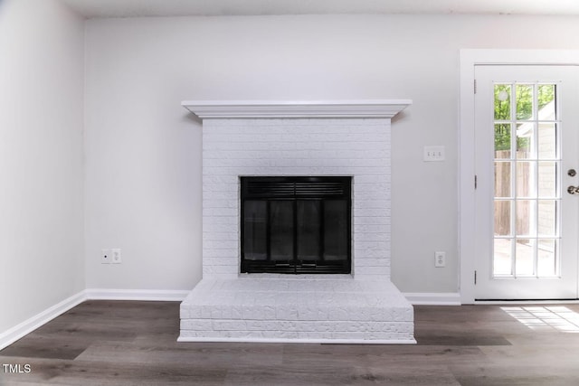 404 Shannonford Ct, Wake Forest, NC 27587 - detailed view of wood finished floors, a brick fireplace, and baseboards