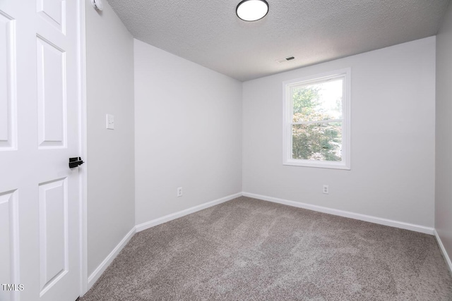404 Shannonford Ct, Wake Forest, NC 27587 - unfurnished room featuring carpet flooring, a textured ceiling, and baseboards