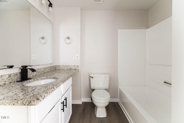 404 Shannonford Ct, Wake Forest, NC 27587 - bathroom with vanity, wood finished floors, toilet, and baseboards