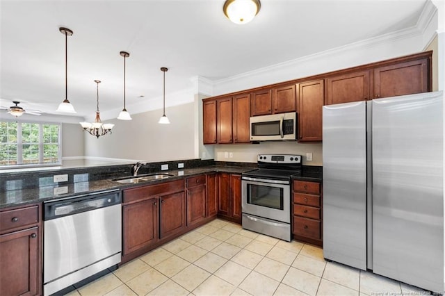 427 Georgetown Cir, Fayetteville, NC 28314 - kitchen with appliances with stainless steel finishes, a sink, crown molding, light tile patterned flooring, and pendant lighting