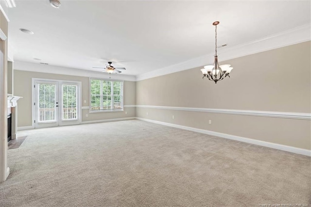 427 Georgetown Cir, Fayetteville, NC 28314 - unfurnished living room featuring a ceiling fan, crown molding, a chandelier, baseboards, and light colored carpet