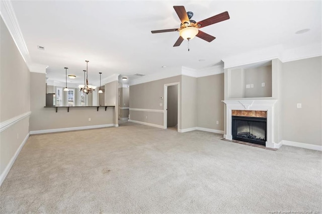 427 Georgetown Cir, Fayetteville, NC 28314 - unfurnished living room with crown molding, a high end fireplace, light colored carpet, ceiling fan, and a chandelier