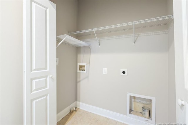 427 Georgetown Cir, Fayetteville, NC 28314 - laundry room with hookup for an electric dryer, baseboards, washer hookup, and light tile patterned flooring