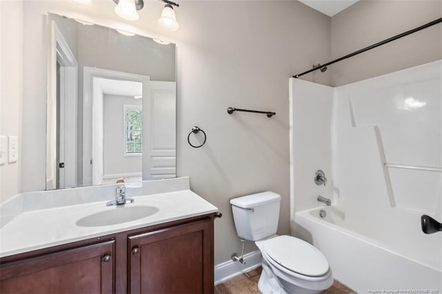 427 Georgetown Cir, Fayetteville, NC 28314 - bathroom featuring vanity, toilet, bathtub / shower combination, and baseboards
