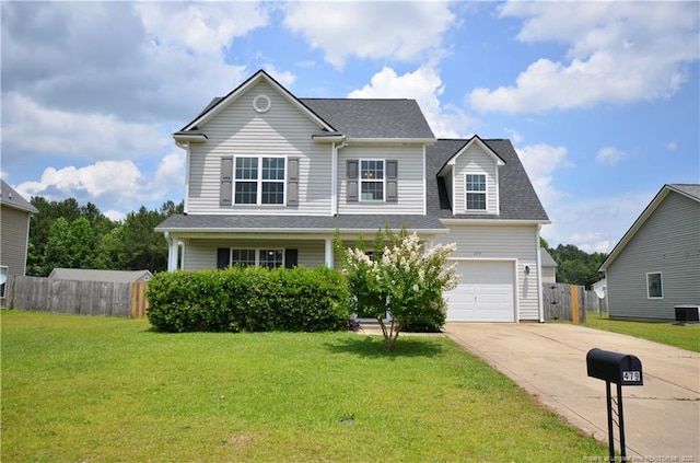 479 Broad Dr, Raeford, NC 28376 - traditional home featuring driveway, central AC, a garage, and a shingled roof