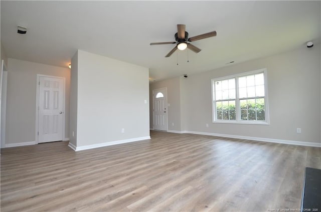 479 Broad Dr, Raeford, NC 28376 - unfurnished living room with a ceiling fan, light wood-style flooring, and baseboards