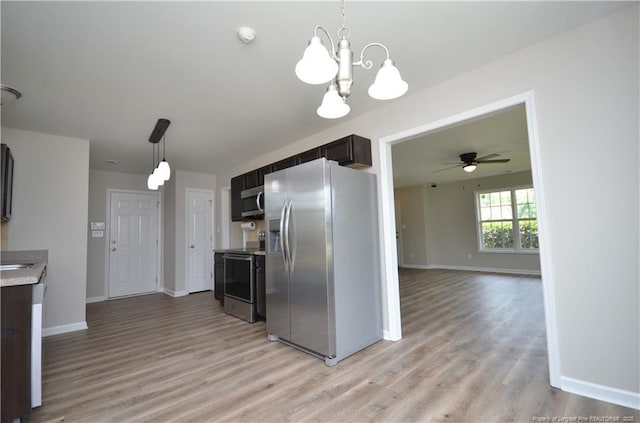 479 Broad Dr, Raeford, NC 28376 - kitchen with stainless steel appliances, light wood-type flooring, light countertops, and baseboards