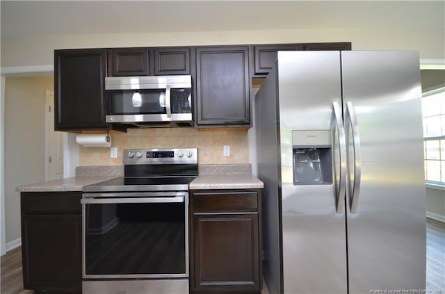 479 Broad Dr, Raeford, NC 28376 - kitchen featuring stainless steel appliances, decorative backsplash, light countertops, and baseboards