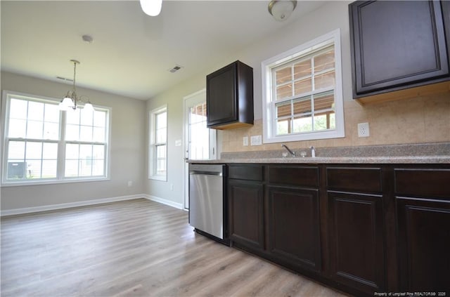 479 Broad Dr, Raeford, NC 28376 - kitchen with dishwasher, light wood-style flooring, decorative backsplash, a chandelier, and healthy amount of natural light