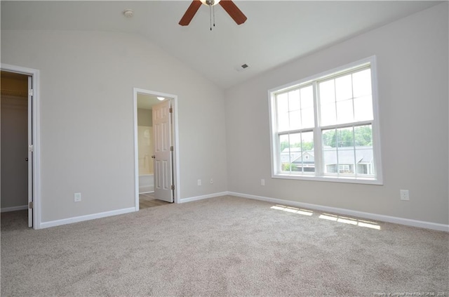 479 Broad Dr, Raeford, NC 28376 - unfurnished bedroom with a walk in closet, carpet floors, lofted ceiling, baseboards, and a closet