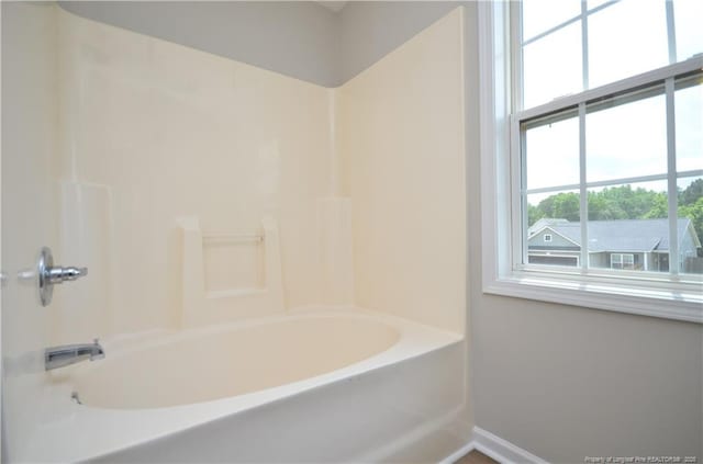 479 Broad Dr, Raeford, NC 28376 - full bath featuring baseboards and shower / washtub combination