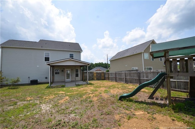 479 Broad Dr, Raeford, NC 28376 - back of property featuring a patio, a playground, and central AC unit