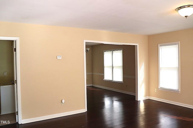 2204 Caroline Dr, Durham, NC 27705 - unfurnished room with baseboards and dark wood-style flooring