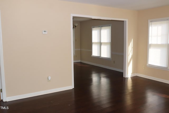 2204 Caroline Dr, Durham, NC 27705 - unfurnished room featuring dark wood-type flooring and baseboards