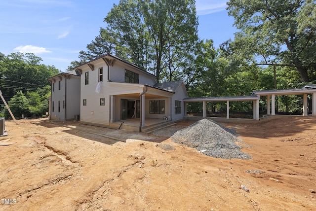 1221 Dixie Trl, Raleigh, NC 27607 - rear view of property with a patio and a carport