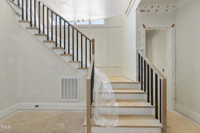 1221 Dixie Trl, Raleigh, NC 27607 - stairway featuring baseboards