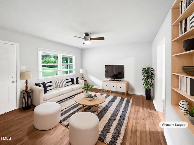 1311 Meadow Ln, Chapel Hill, NC 27516 - living area with wood finished floors, a ceiling fan, and baseboards