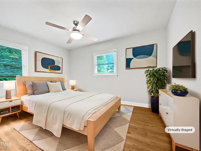 1311 Meadow Ln, Chapel Hill, NC 27516 - bedroom featuring light wood-type flooring, ceiling fan, and baseboards