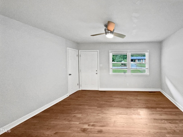 1311 Meadow Ln, Chapel Hill, NC 27516 - unfurnished room with wood finished floors, baseboards, and ceiling fan