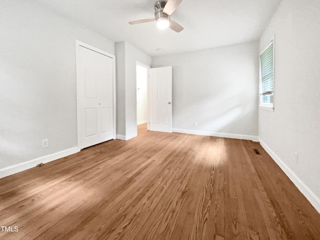 1311 Meadow Ln, Chapel Hill, NC 27516 - unfurnished bedroom featuring wood finished floors, baseboards, and a ceiling fan