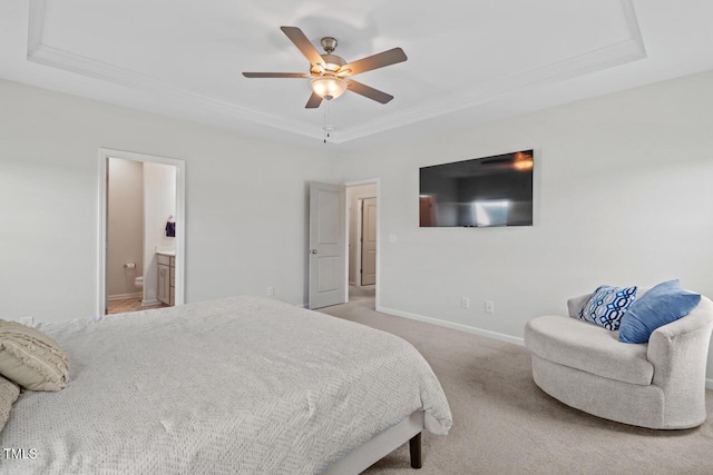 509 Rain Drizzle Ct, Wake Forest, NC 27587 - carpeted bedroom featuring a raised ceiling, ornamental molding, connected bathroom, and ceiling fan