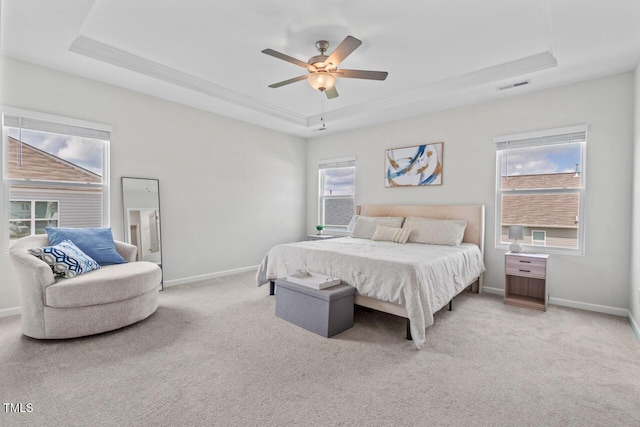 509 Rain Drizzle Ct, Wake Forest, NC 27587 - bedroom featuring a tray ceiling, light carpet, and ceiling fan