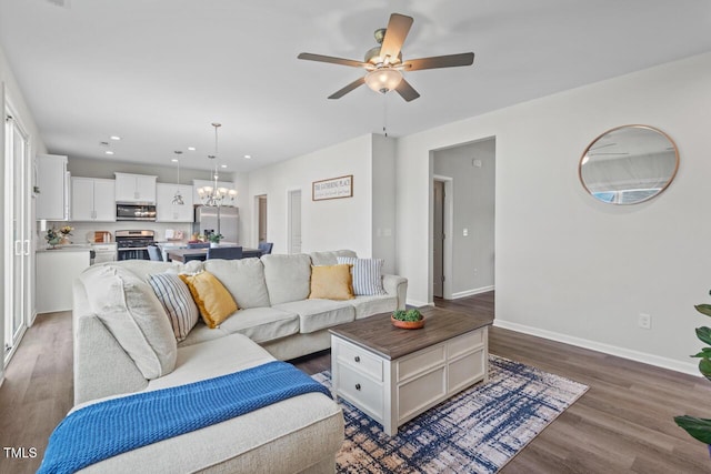 509 Rain Drizzle Ct, Wake Forest, NC 27587 - living area with wood finished floors, a ceiling fan, a chandelier, and recessed lighting