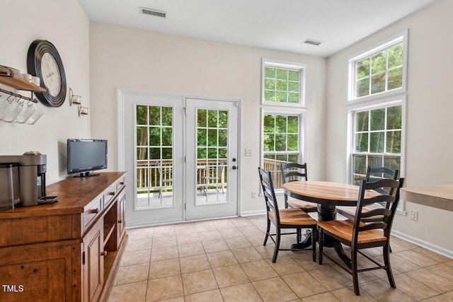 1406 Pebble Creek Xing, Durham, NC 27713 - dining area with light tile patterned floors and baseboards