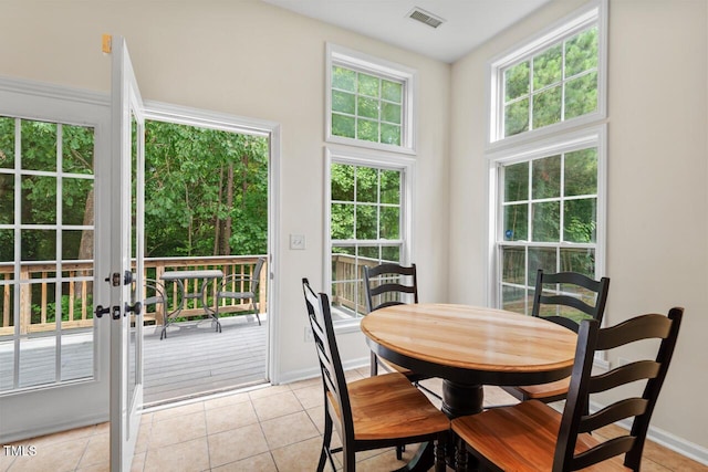 1406 Pebble Creek Xing, Durham, NC 27713 - dining area with light tile patterned floors and french doors