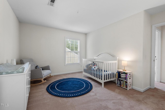 1406 Pebble Creek Xing, Durham, NC 27713 - carpeted bedroom featuring baseboards and a nursery area